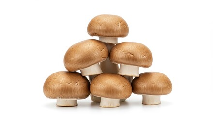 Fresh Brown Mushrooms Forming a Pyramid Against a White Background
