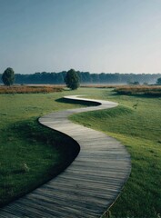Naklejka premium Serpentine wooden path winding through a grassy landscape
