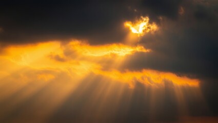 Dramatic sunset sky with golden sunbeams piercing dark clouds, casting long crepuscular rays and a warm, serene glow across the atmospheric cloudscape