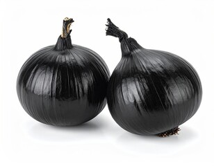 Two black onions; white backdrop; textured
