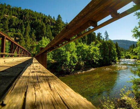 Rustic wooden bridge over a river - Powered by Adobe