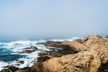 Fog over ocean and rocks