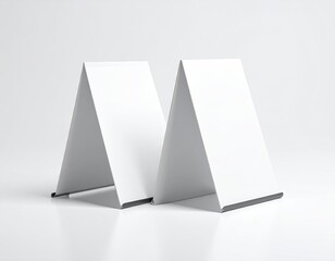 Two blank A-frame signs on a glossy white surface