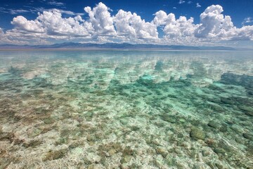 Shallow Crystal Clear Water With Rocks And Blue Sky