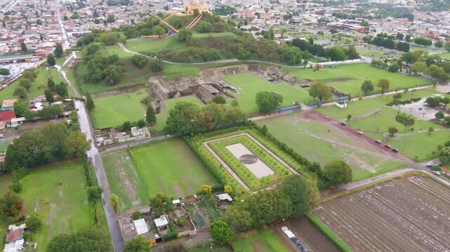 Cholula, Puebla, Mexico, aerial view of the Remedios Church on the top of the great pyramid, Popocatepetl volcano at the background