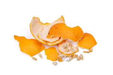 Orange peel and orange seeds separated on white background - top view