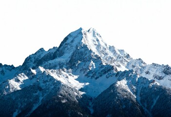 Obraz premium A majestic snow-capped mountain peak against a bright sky, showcasing winter grandeur.