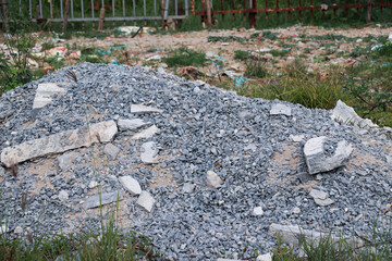 Small broken stones scattered on gravel path in construction working area