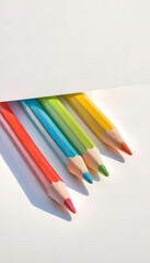 Colorful Pencils Arranged on White Background