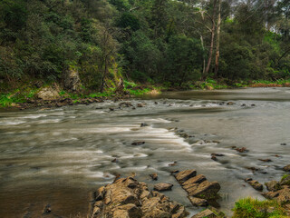 Dreamy Smooth River Flows Over Rapids