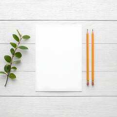 Flat lay of blank white paper sheet with two yellow pencils and green leaf branch on white wooden background, perfect for mockup, branding, message design, natural minimal workspace, or creative layou