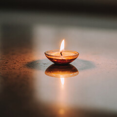 Single diya on a dark background