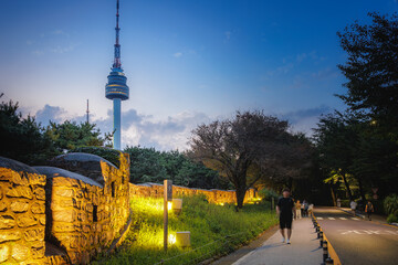 Night view of Namsan N Seoul Tower and fortress walls in Seoul, South Korea