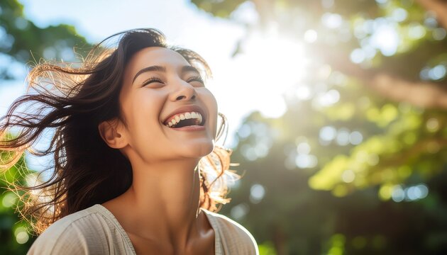 Woman laughing in sunlight