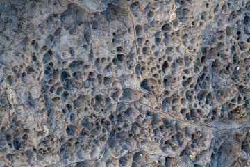Haloclasty ( salt weathering), Tafoni. Basalt. Napili Bay, West Maui, Hawaii. Lava flows, Honolua Volcanics ( Pleistocene ), West Maui Volcano.

