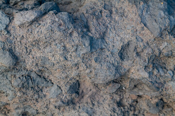 Breccia is a rock composed of large angular broken fragments of minerals or rocks cemented together by a fine-grained matrix. Napili Bay, West Maui, Hawaii.