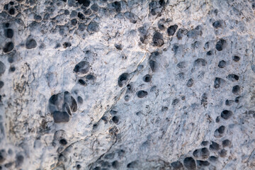Haloclasty ( salt weathering), Tafoni. Basalt. Napili Bay, West Maui, Hawaii. Lava flows, Honolua Volcanics ( Pleistocene ), West Maui Volcano.

