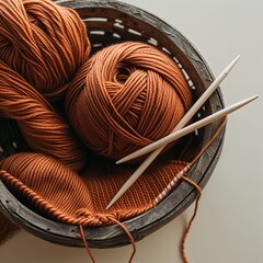 Rustic basket with brown color knitting yarn and knitting needles
