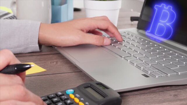 Animation of a virtual bitcoin icon on a computer