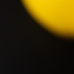 Blurred Yellow Circle on Dark Background. Abstract Emotional Glow backdrop