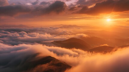 Fototapeta premium Witness the breathtaking landscape of mountains and clouds enveloped in the warm glow of a sunset, casting an ethereal and majestic ambiance.