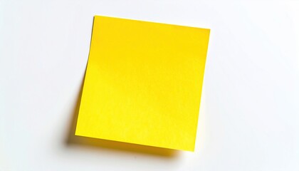 Fototapeta premium Bright yellow sticky note on clean white surface beckons for your important messages, ideas, to-do lists, and creative brainstorming sessions