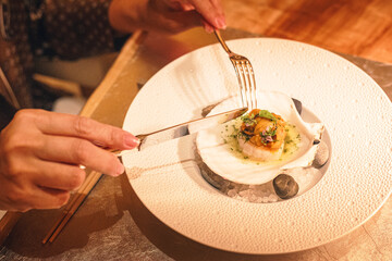 Fine dining Japanese cuisine plated on a shell