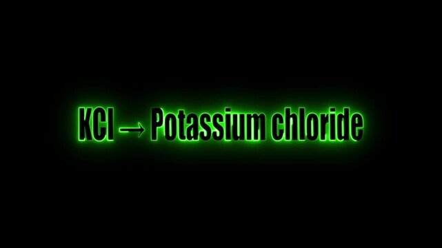 Green neon text shows K Cl arrow Potassium chloride on black background chemical formula chemistry