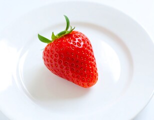 Single strawberry on white plate (1)