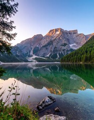 Calm lake reflects mountain landscape
