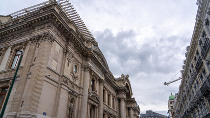 Ornate building facade with a crane in the background.