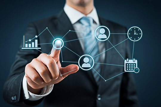 Businessman interacting with virtual interface showing data and network connections