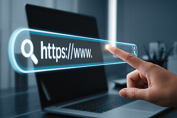 Finger touching a glowing search bar on a laptop screen for online browsing and internet access