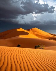 Desert dunes under stormy sky