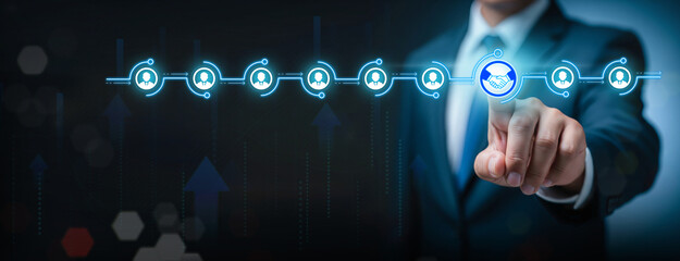Choosing the Right Business Partner in Digital Network, Finger points to handshake icon among glowing profile connections