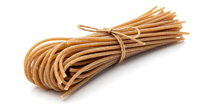 Dry whole grain spaghetti bundle tied with natural twine, isolated on white background. Healthy pasta ingredient.