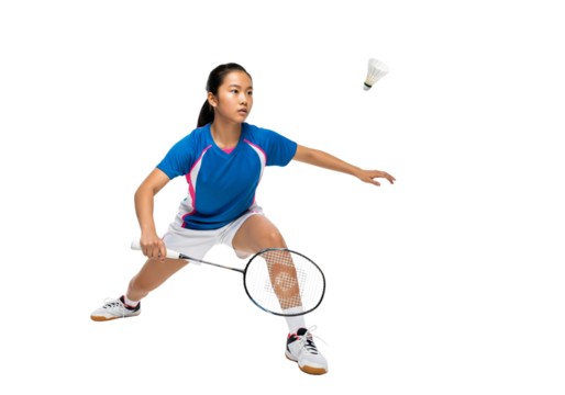 A young badminton player focused on hitting a shuttlecock during a match, showcasing athleticism and dedication.