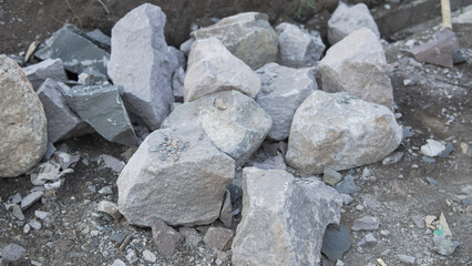 Assortment of Rough Textured Stones and Gravel on Uneven Ground