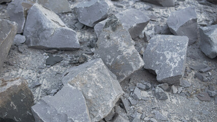 Rough Grey Stones and Crushed Rocks Pile Up on the Ground