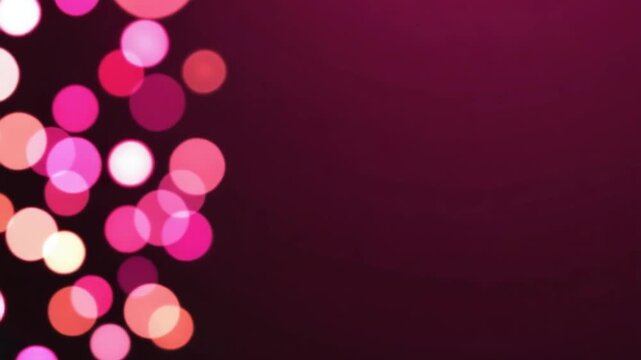 Blurred pink and orange circles floating on a dark maroon background creating a bokeh effect bokeh light blur background patterns video