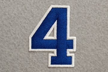Stitched number patch four on felt background detailed thread texture isolated