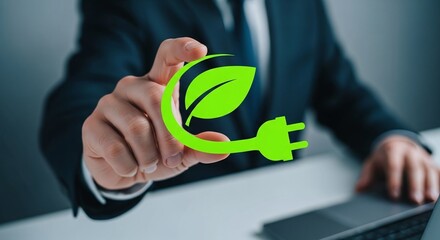 Businessman touching glowing green eco energy plug icon, representing sustainable power in a modern office environment