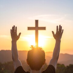 Person with arms raised in worship at a cross