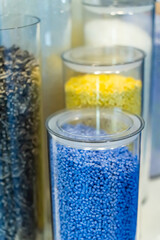 Colored polymer granules in glass