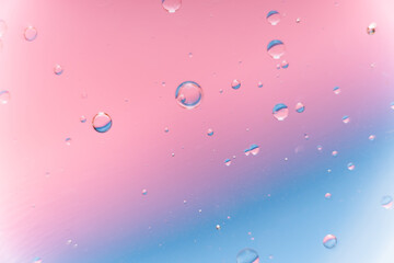 Pink and Blue Gradient Background with Floating Water Bubbles