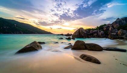 Scenic coastal sunset view with rocks and turquoise water