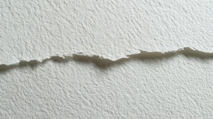 Abstract close-up of textured paper with torn edge detail.