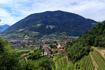Mountain panorama with Lagundo Waalweg path and village Algund in South Tyrol, Italy