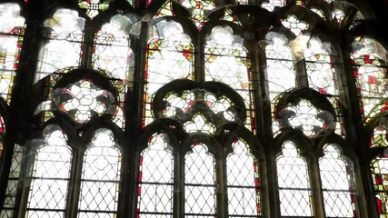 Stained Glass Window with Floral Designs Casting Light Patterns - Powered by Adobe