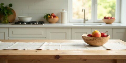 A kitchen table runner showcases a rustic wooden bowl filled with ripe, red fruit in a bright, modern kitchen setting.